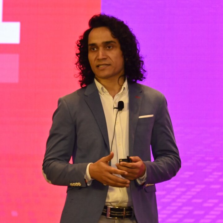 Hemant Sajwan speaking on stage